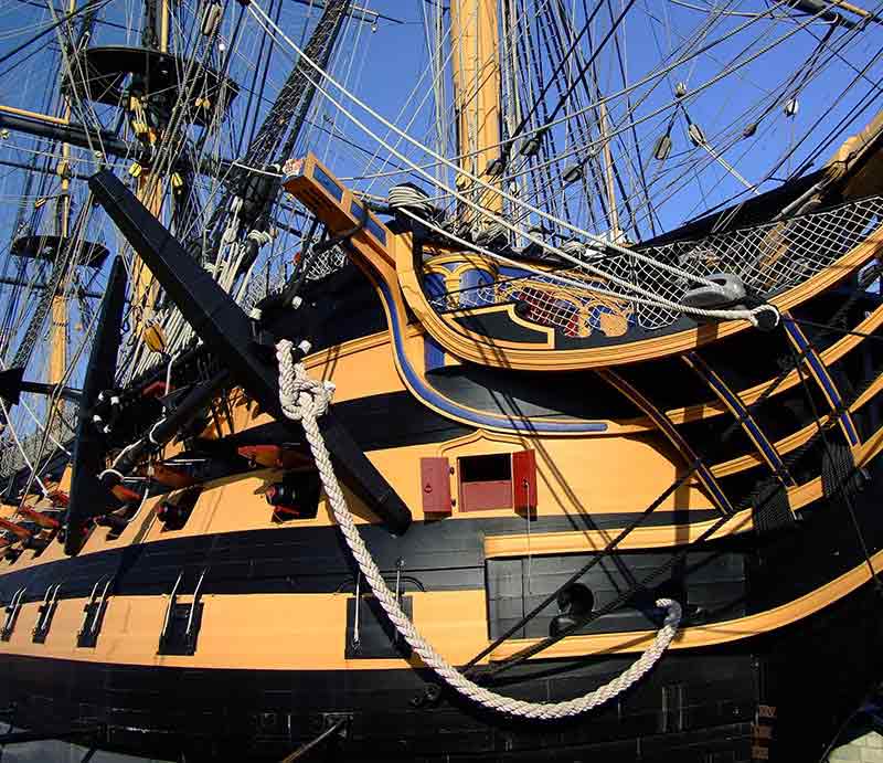 HMS Victory with its distinctive yellow and black hull.