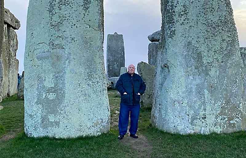 Stood between two giant sarsen stones at Stonehenge.